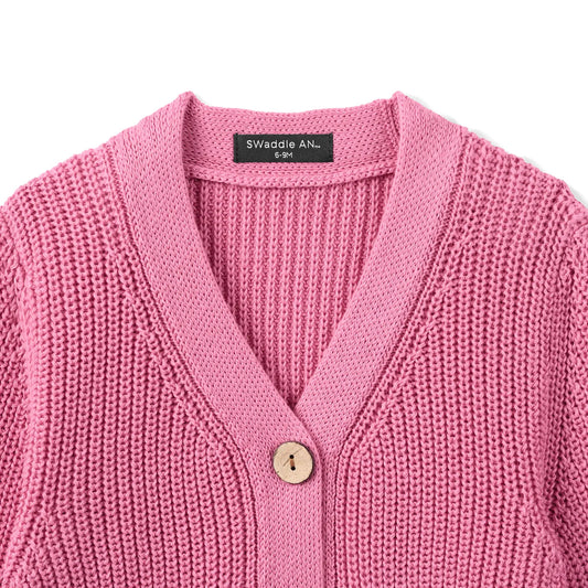 Rose pink knit cardigan close-up: V-neck and round wood-look buttons
