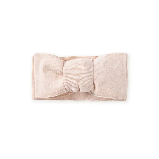 Beige knitted headband with oversized bow and ribbed topknot knot in center