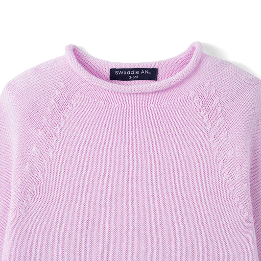 Lilac knit baby sweater with rollneck and textured shoulder yoke stitching