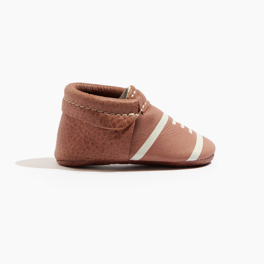 Brown baby soft-sole shoes with striped ankle band and hook-and-loop strap, side view
