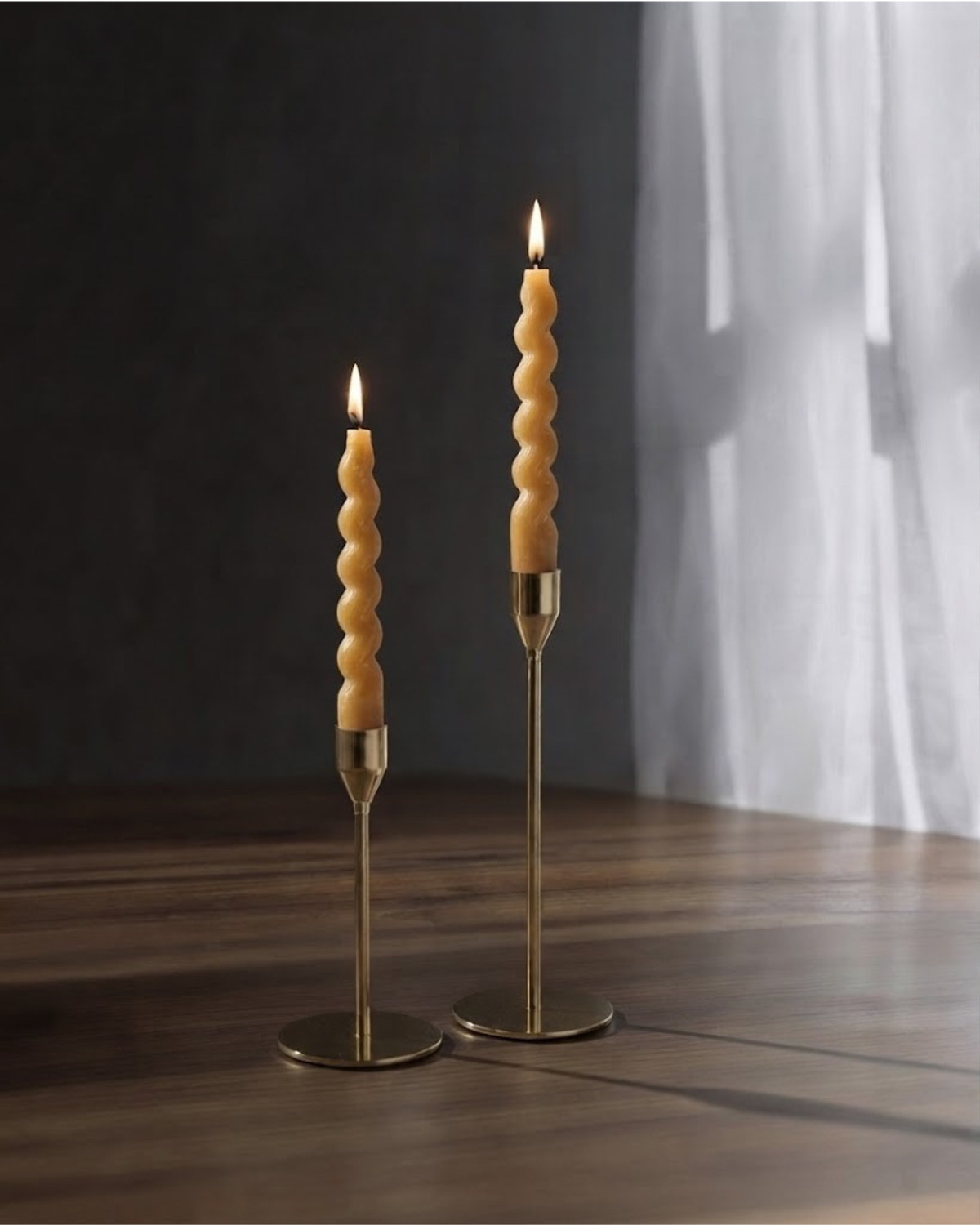 Swirl taper candle set with spiral tan candles on two gold-tone stands