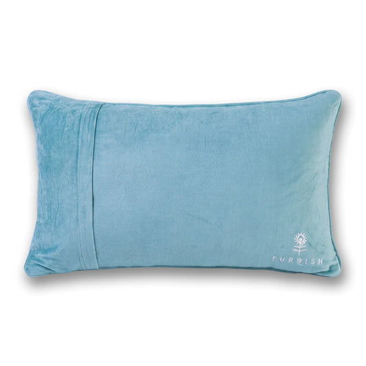 Blue holiday throw pillow with side piping seam and small “FURBISH” logo