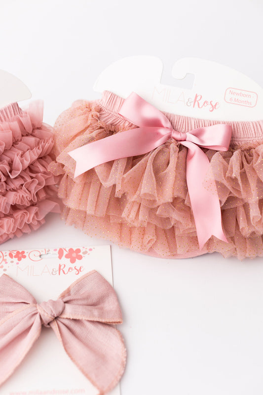 Pink glitter tutu bloomer with elastic waist, satin bow, and layered ruffles