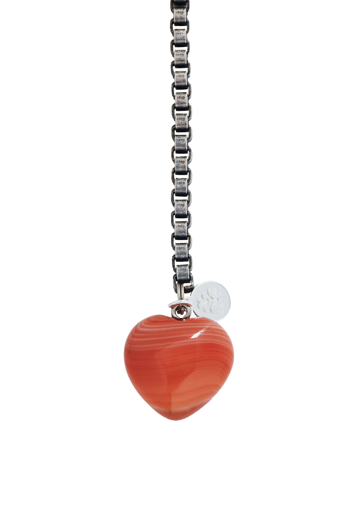 Heart charm pendant on silver chain with small round tag