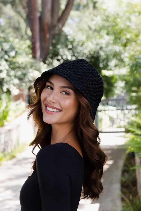 Black handwoven crochet bucket hat with textured stitch pattern and soft slouch brim