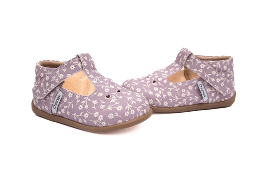 Pair of kids lavender floral Mary Janes with T-strap and tan rubber sole