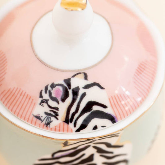 Close-up of tiger-print sugar bowl lid with gold-edged rim