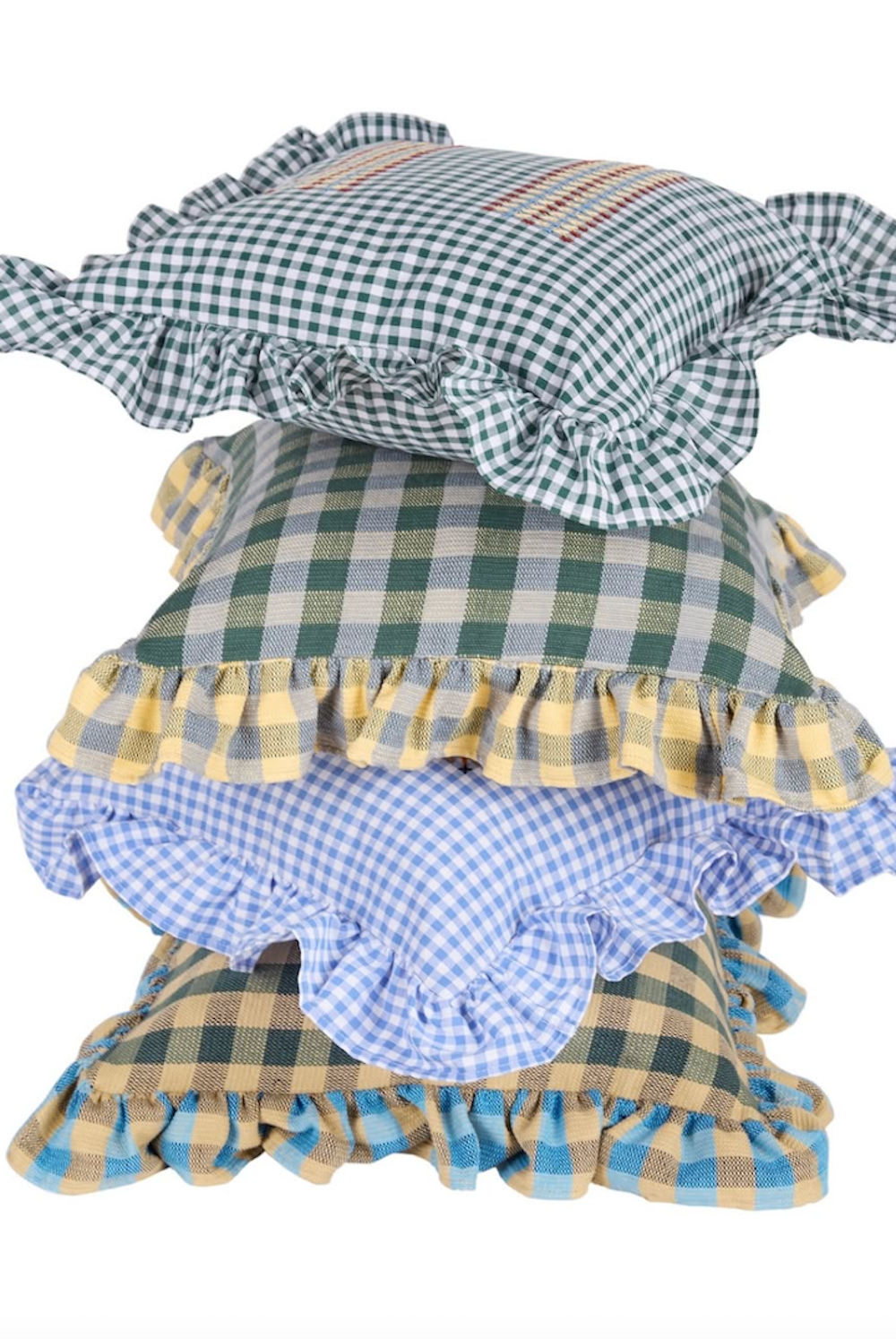Stacked checkered cushions in blue, green, and yellow with ruffled trim