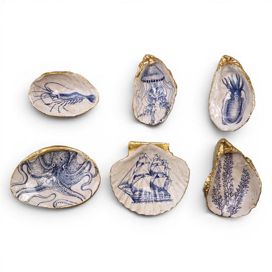 Set of six blue sea-life shell trinket dishes with gold edging, assorted shapes