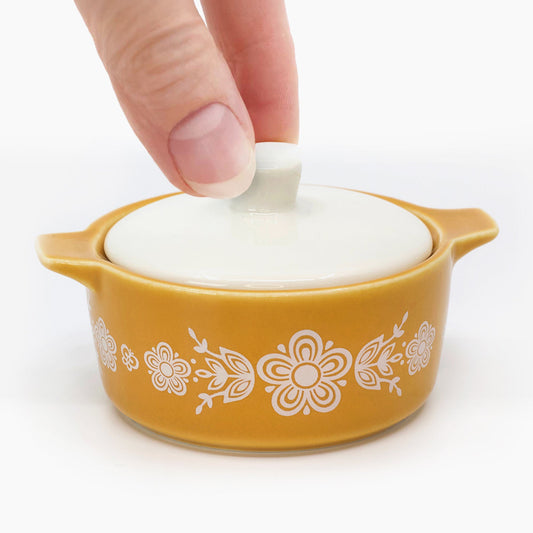 Yellow ceramic casserole trinket box with white lid and white floral butterfly pattern