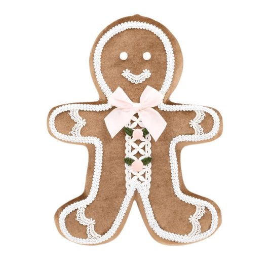 Brown gingerbread boy ornament with white icing trim, pink bow, and green details