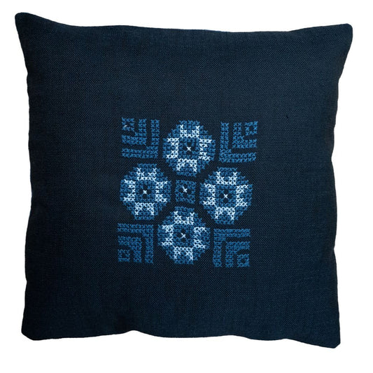 Blue pillow cover with cross-stitch style geometric and snowflake pattern embroidery
