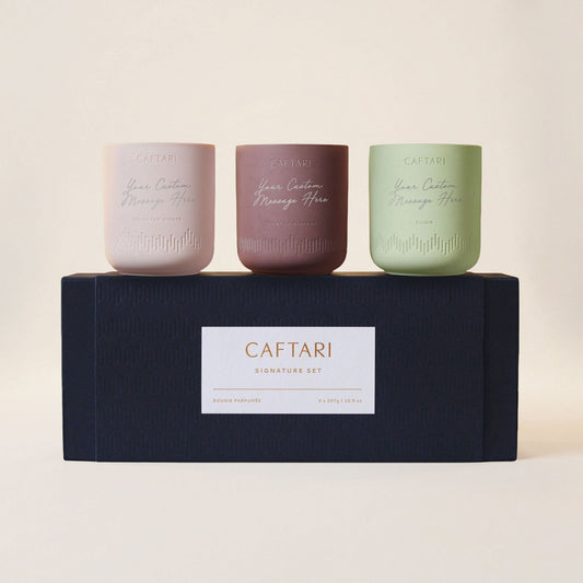 Signature gift set of three Caftari candles in pink, brown, and sage with gift box label