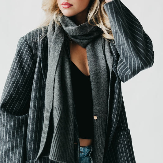 Charcoal cashmere wrap scarf with ribbed knit texture and matching beanie, close view