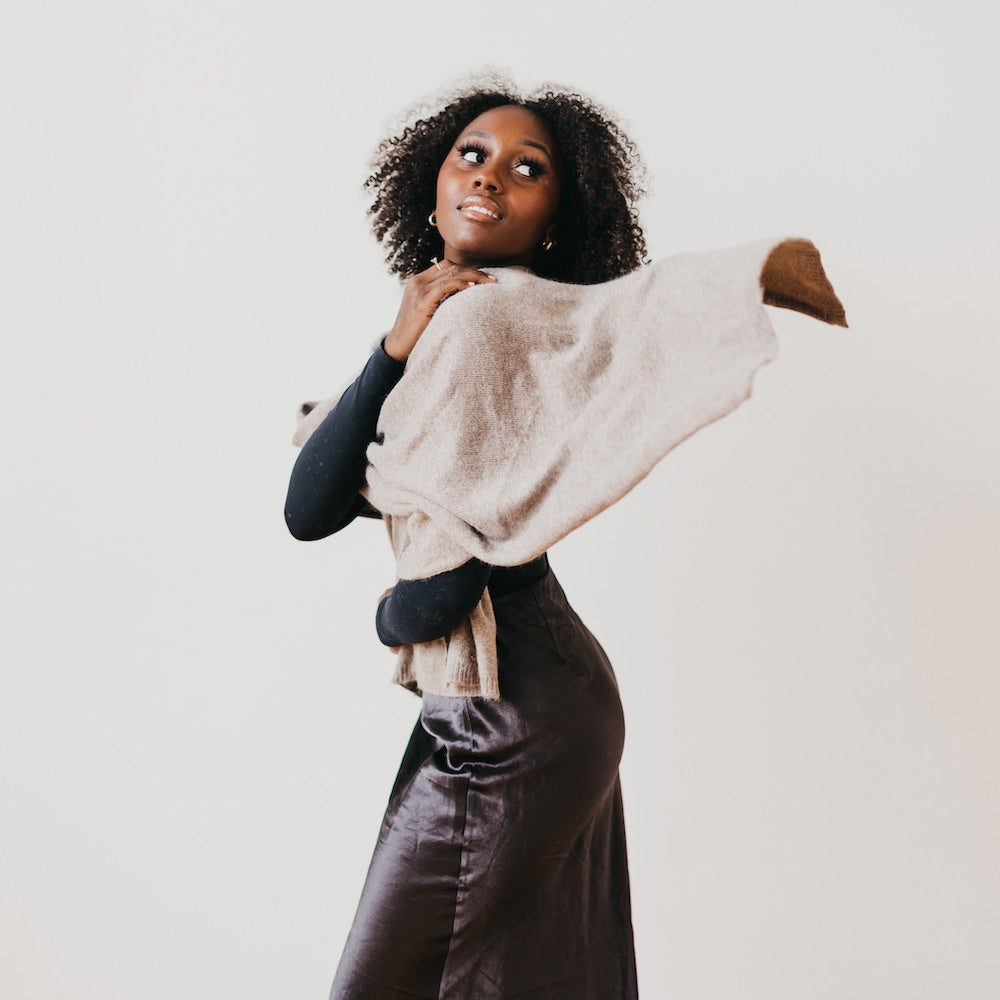 Mocha cashmere wrap with soft knit texture, draped across shoulders