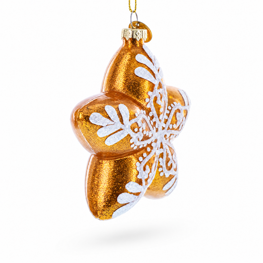 Gold glass star ornament with white snowflake lace details, hanging from gold loop