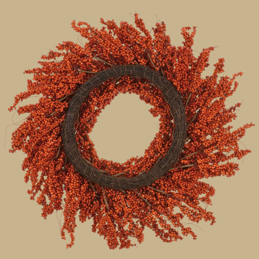 Orange berry wreath on dark woven ring, dense twig-like sprigs around center