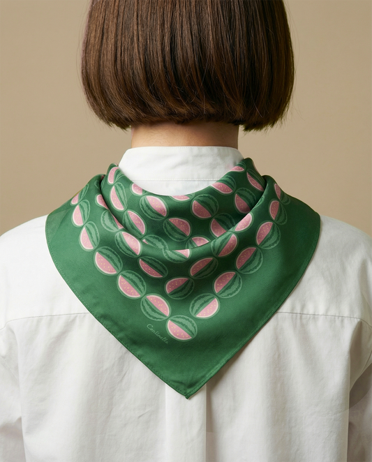 Green cotton-silk neckerchief with pink watermelon slice pattern on white shirt