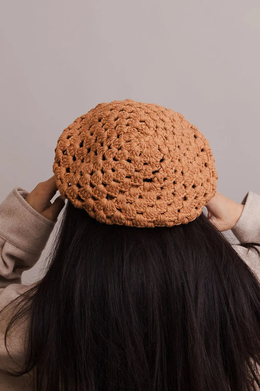 Camel crochet knit beret with diamond stitch, worn from the back