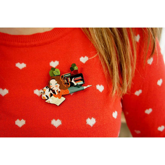 Laliblue diary enamel brooch on red sweater with hearts; illustrated girl and cat