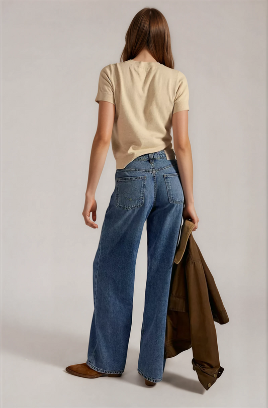 Back view of light blue boyfriend jeans with wide legs and belt loops