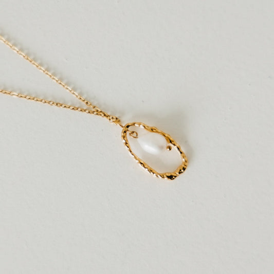 Gold-tone open-circle pearl pendant on thin chain necklace