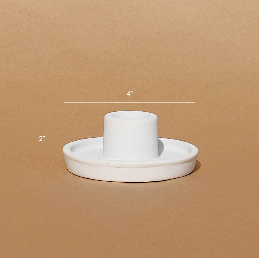 White ceramic candle holder, 4 in wide and 2 in high