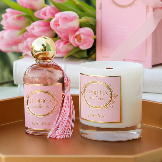 Rose-scent perfume bottle with tassel and matching scented candle, gold label