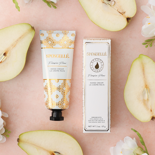 Hand cream tube with orange-and-white pattern and black pump cap, plus box