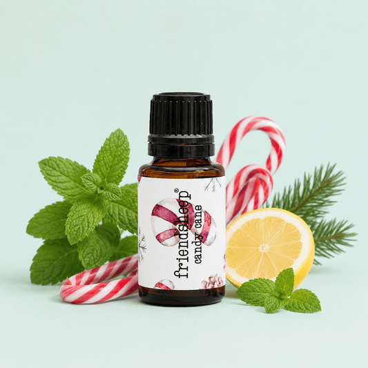 Amber essential oil bottle with black cap and 'candy cane' label, front.