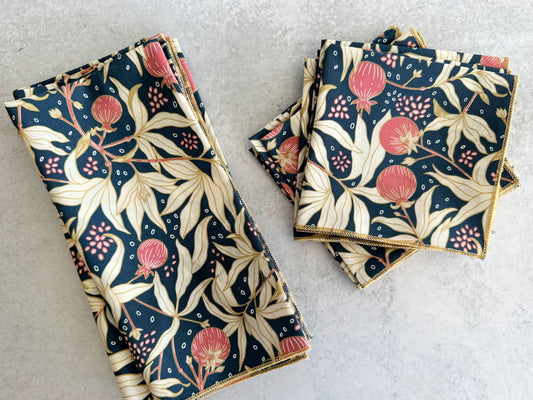 Cloth napkins set of four, navy floral pattern with pink blossoms and cream leaves, stacked