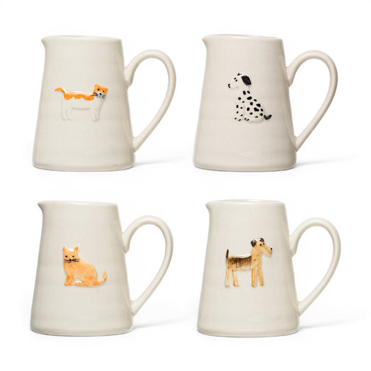 Ceramic animal creamer, painted animals: orange cat, dalmatian, cat, giraffe-like animal.