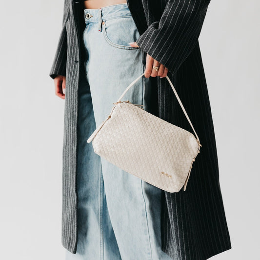 Woven hobo shoulder bag in cream with top zip and long shoulder strap
