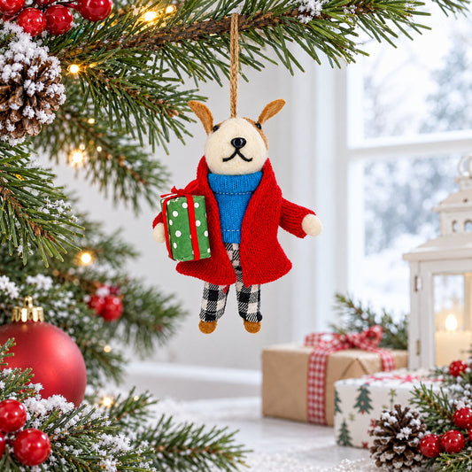 Hanging felt dog ornament with red coat, blue scarf, and green gift ornament