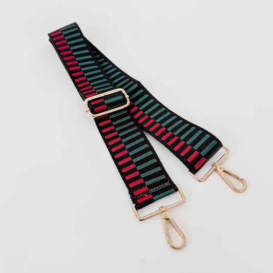 Set of striped bag straps in green, black, and red with gold metal buckles and clips