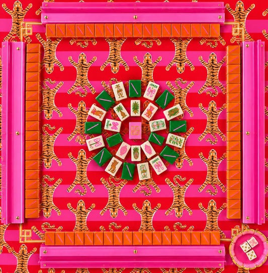 Custom Mahjong mat with a pink and red tiger print, surrounded by Mahjong tiles and racks.