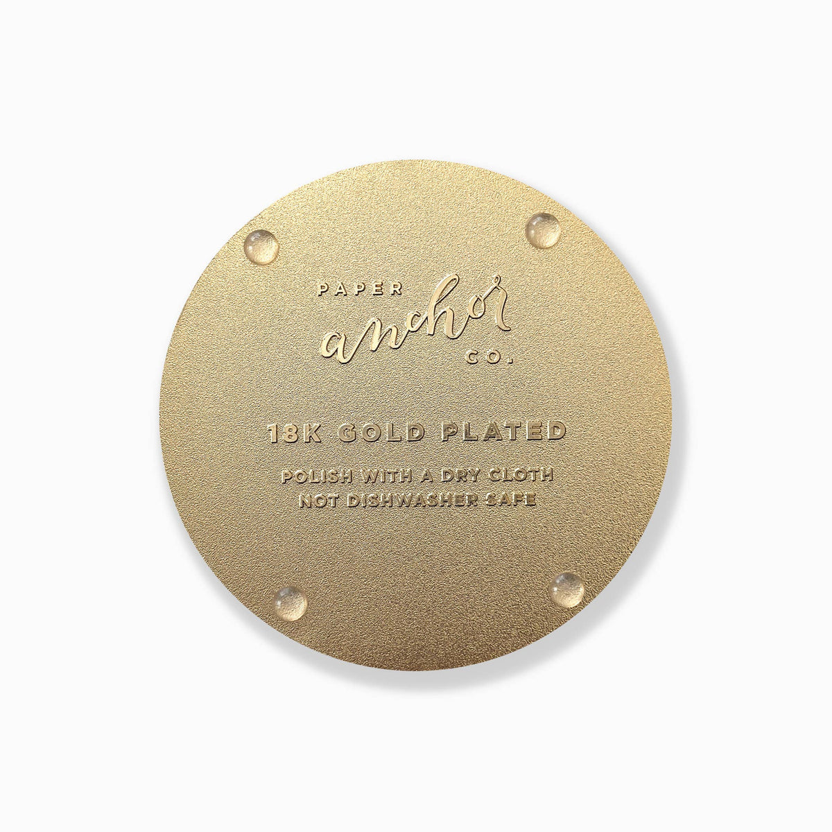 Gold-toned coaster back with corner dots and 18K gold plated text