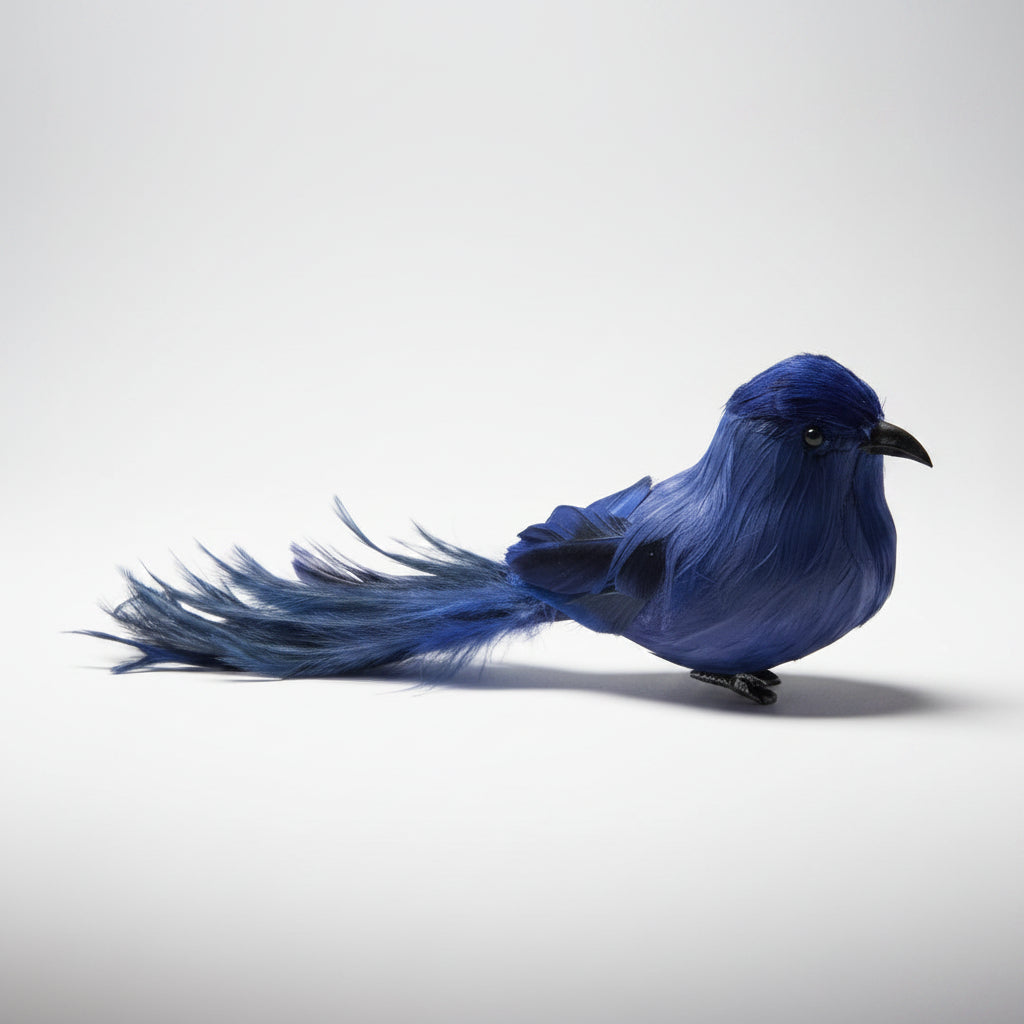 Blue decorative bird with a long feather tail and black beak