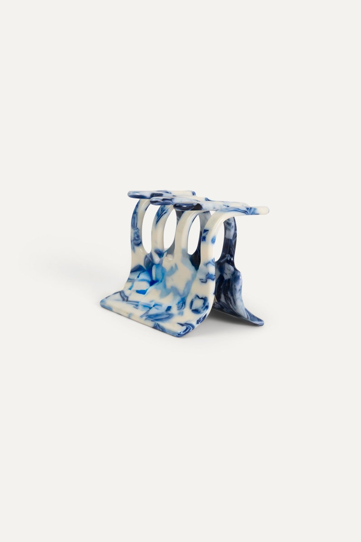 Mini marbled blue-and-white hair claw clip, open side view