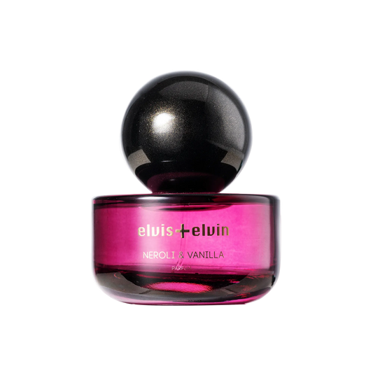 Neroli & Vanilla parfum bottle with round black cap and pink glass base, elvis+elvin