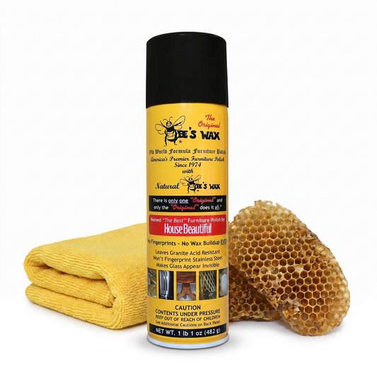 Bee's wax furniture polish bottle with black cap, yellow cloth, and honeycomb pad