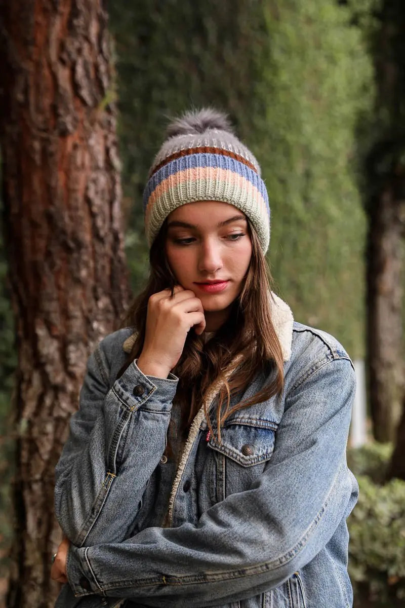 Pastel striped knit beanie with pom-pom; ribbed knit with multicolor bands