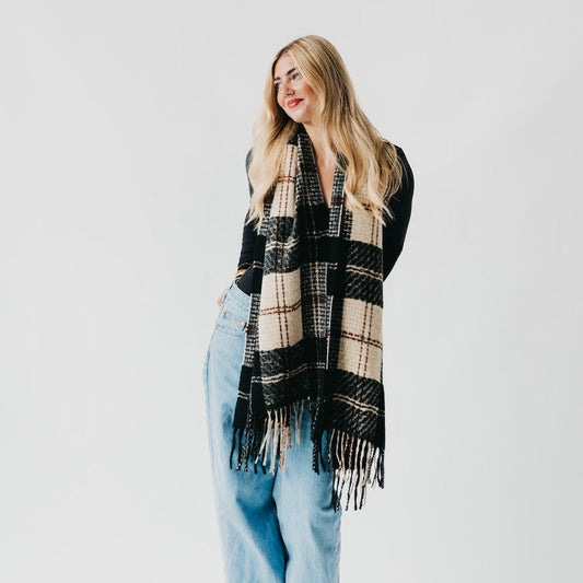 Black and cream plaid fringe scarf, draped over shoulders