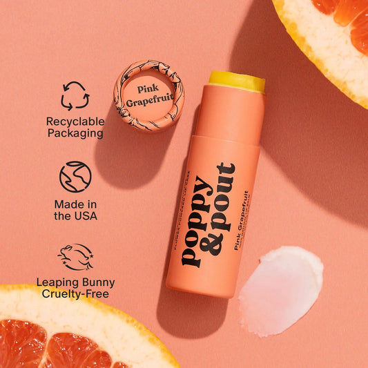 Pink grapefruit lip balm tube with yellow cap and white balm swatch