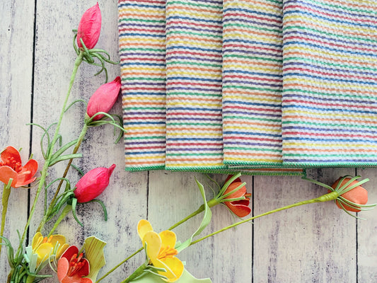 Rainbow striped seersucker cloth napkins, set of four, folded squares stacked