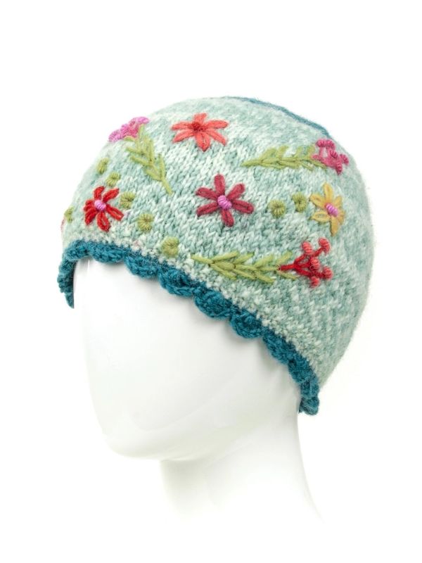Light blue wool knit beanie with multicolor flower embroidery and blue ribbed cuff
