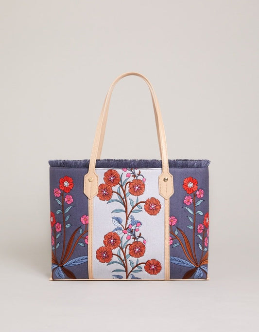 Blue floral shopper tote with cream front panel, tan handles, and open top