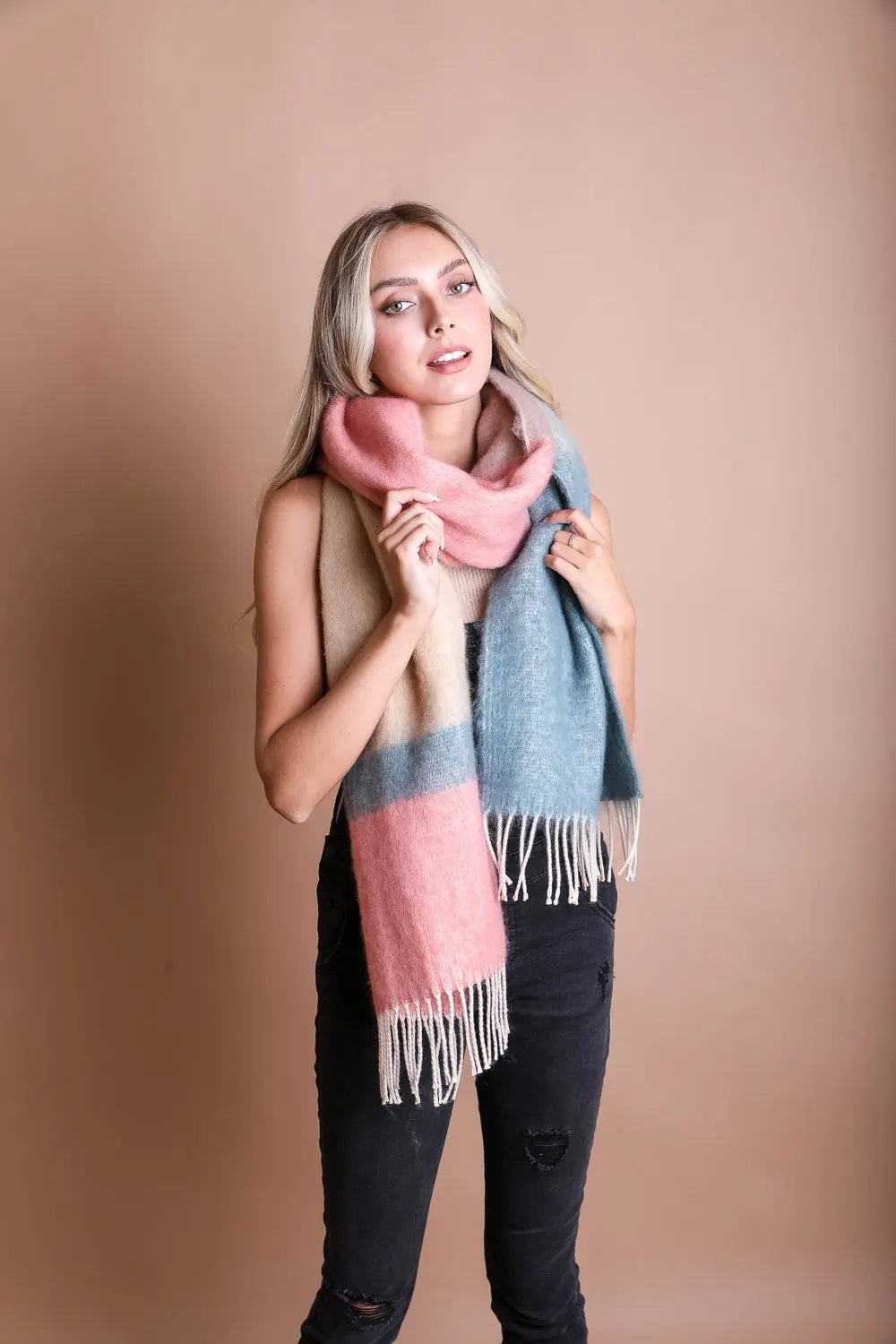 Striped mohair scarf with dusty rose and light blue tones; long fringe ends.