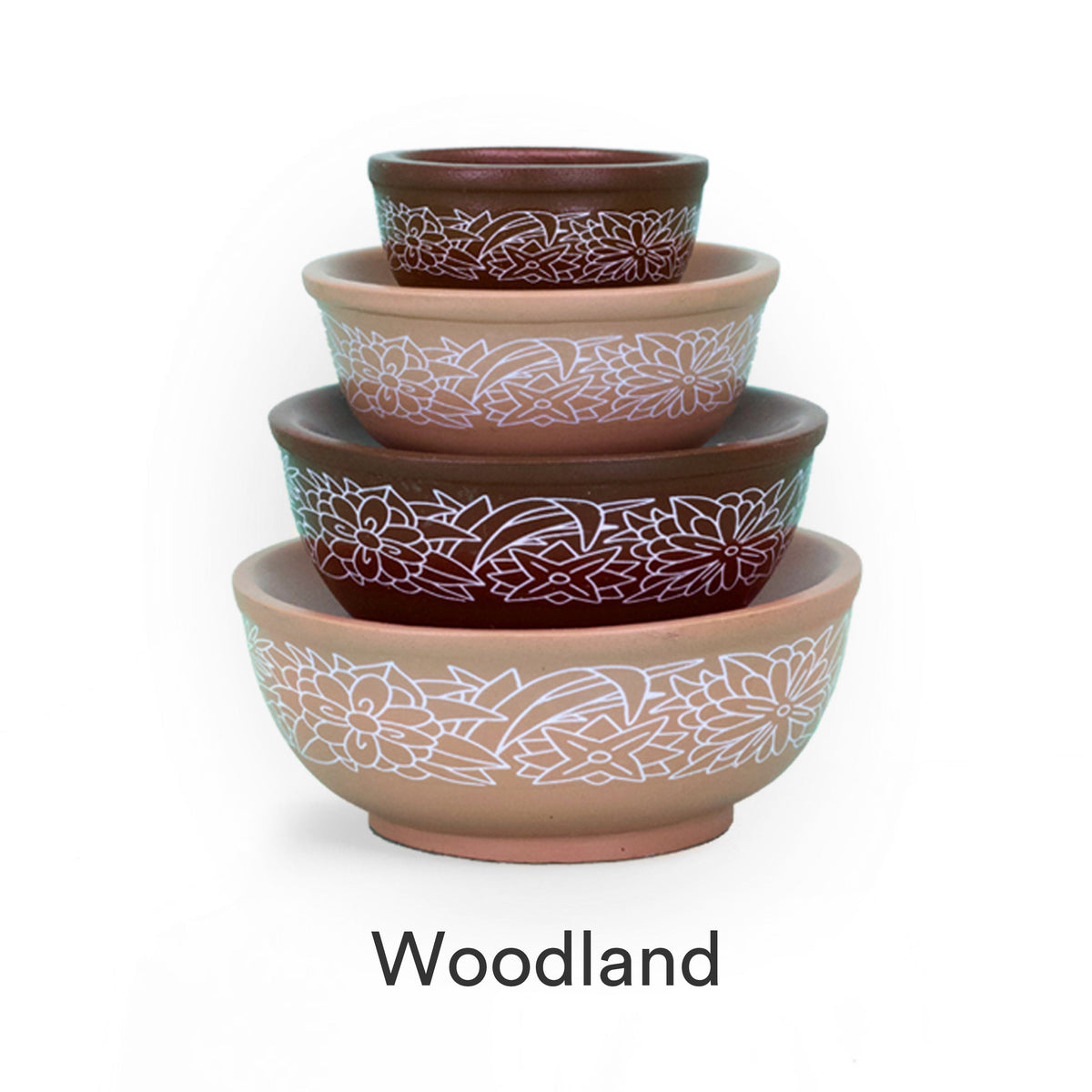 Set of four mini stackable mixing bowls with floral pattern in teal, tan, and red.
