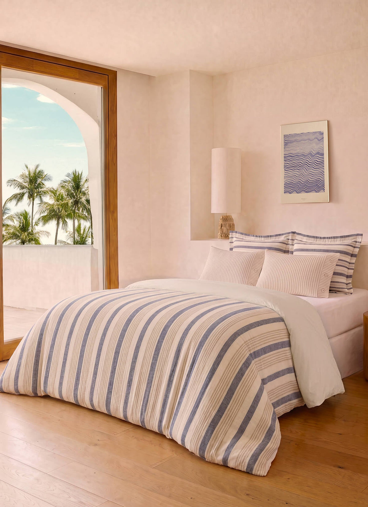 Reversible cotton duvet cover, blue and cream vertical stripes on bed cover